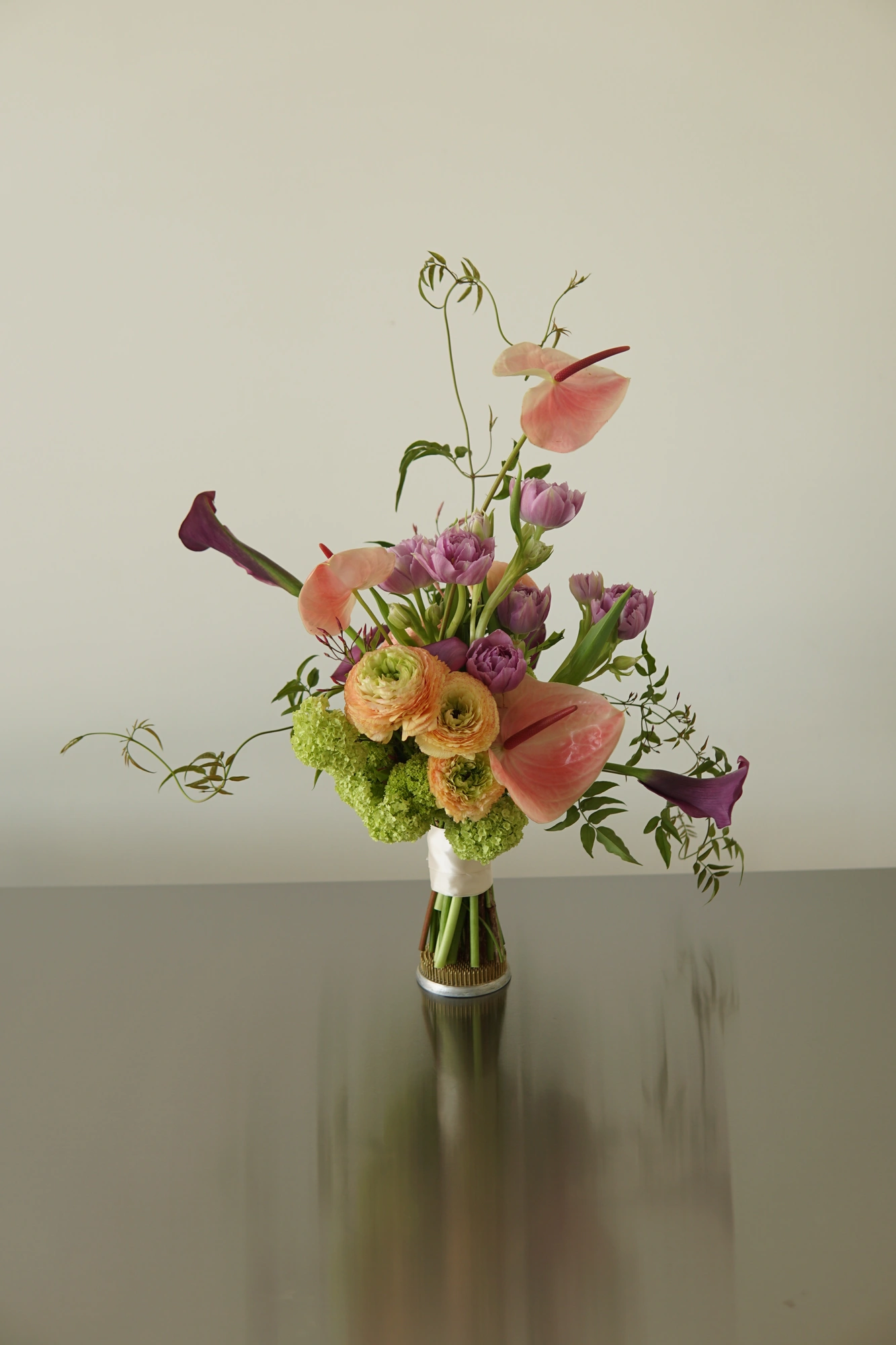 Sculptural bridal bouquet with anthuriums and calla lilies